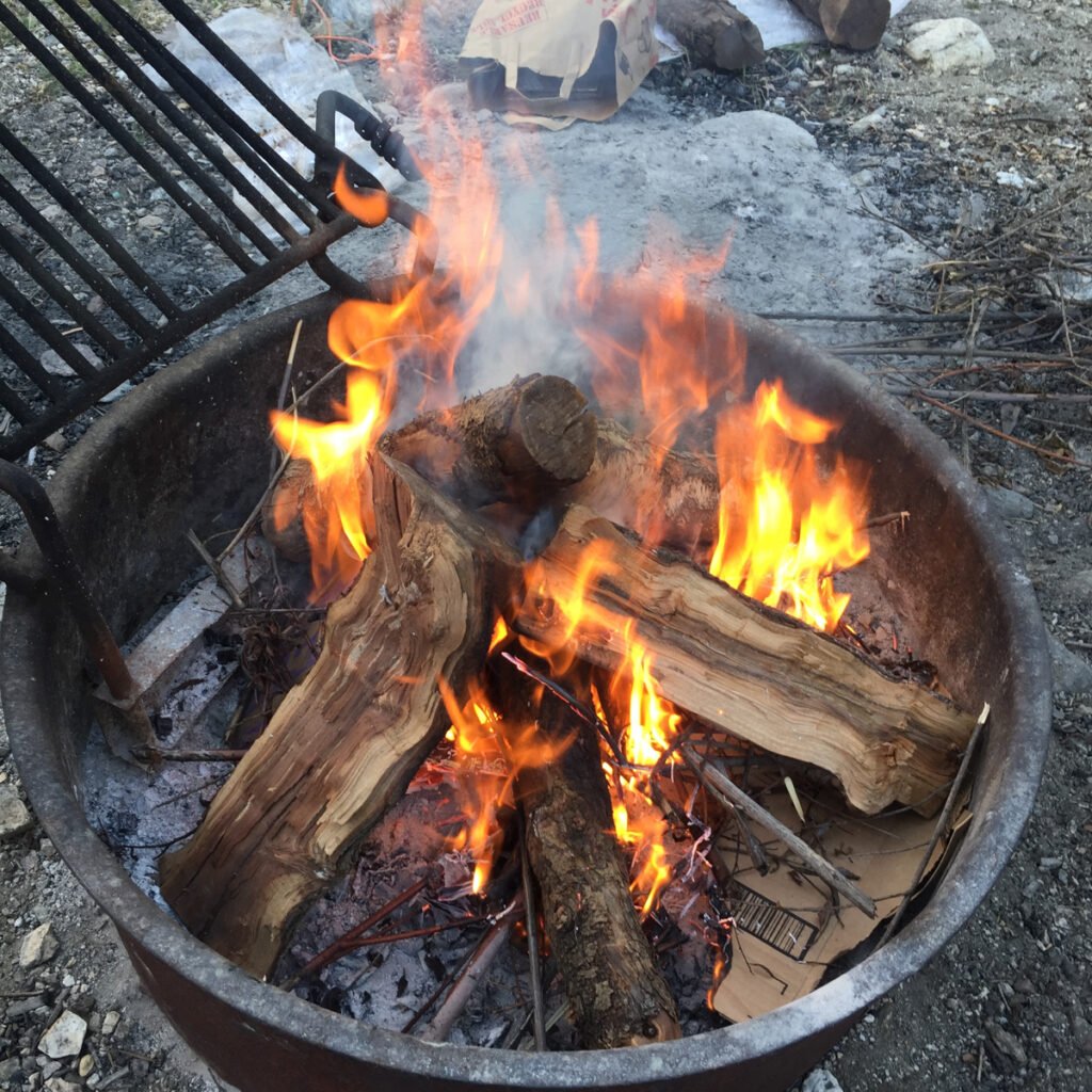 A firepit with a fire burning in it